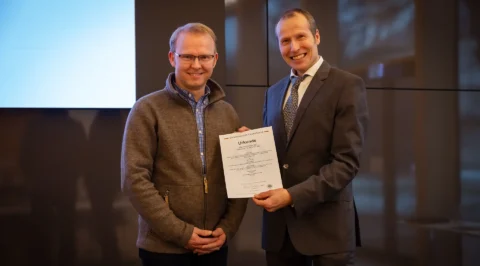 Certificate presentation by Dr Thomas Sperling (right) to Marco Mäbert (left)
